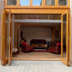 Timber Bifold Door made from Accoya and stained - open view
