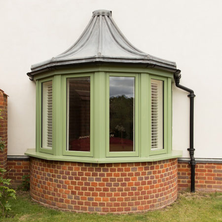 traditional timber casement windows finished in green bow design