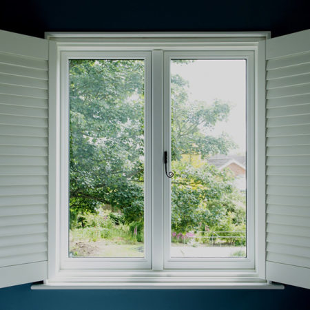 traditional timber casement windows with shutters