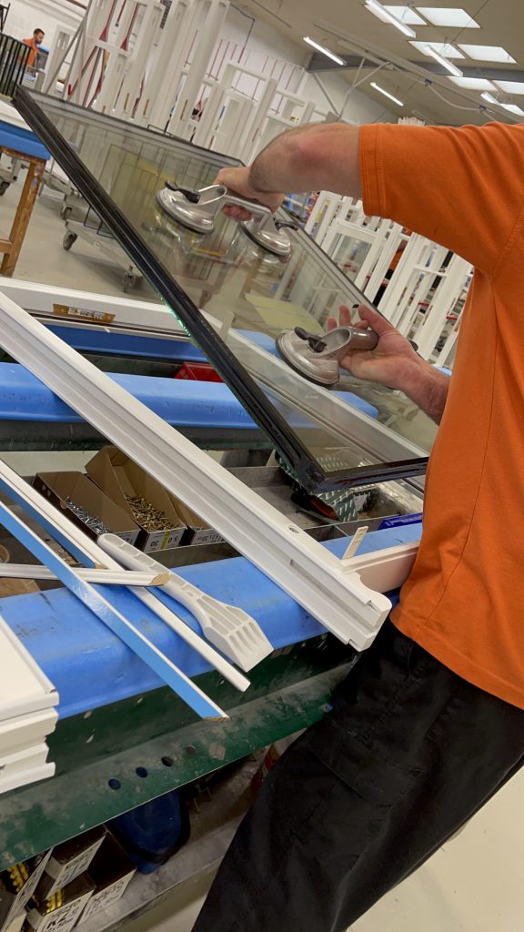 Glazing being installed in a George Barnsdale timber window