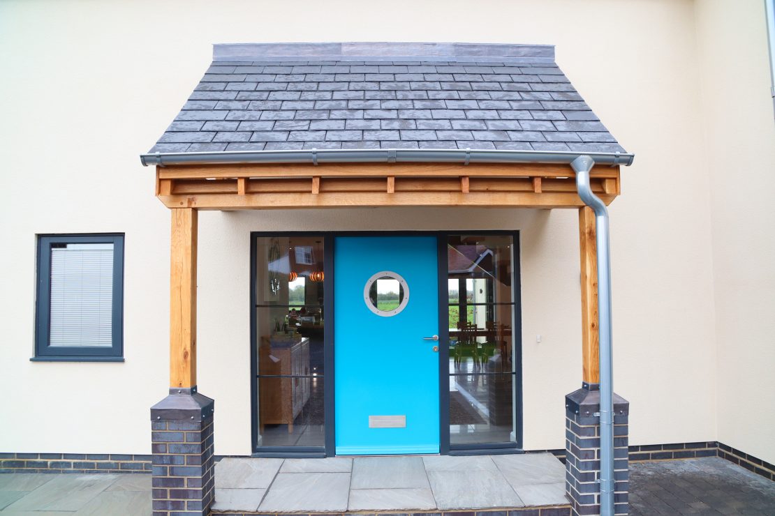 picture of port holepainted in blue with a port hole style window
