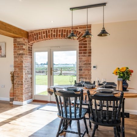 interior view of a country style kitchen with arched top french doors
