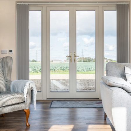 french doors in living room with views across Lincolnshire countryside.