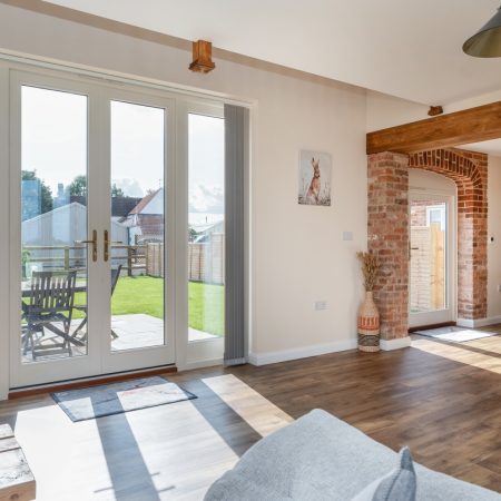 a twin set of timber french doors overlooking the rear garden